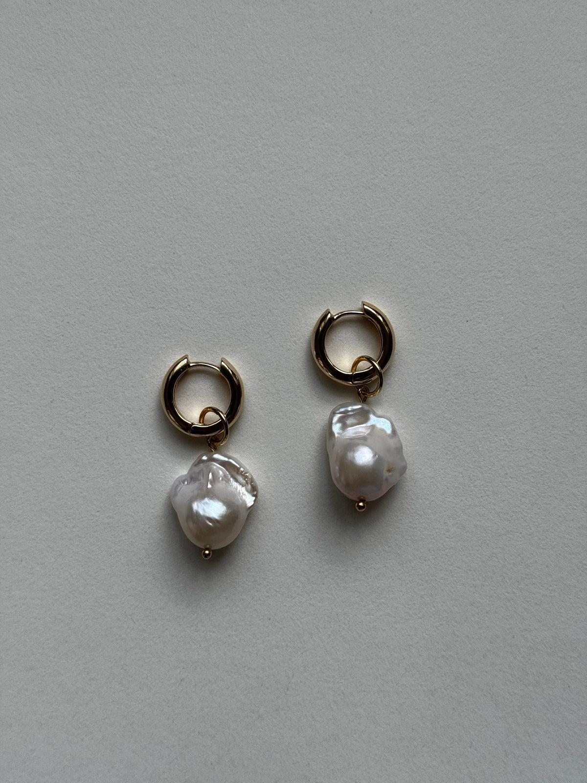 Baroque Pearl Hoops by Claudine Artisanal, gold huggie hoops with freshwater baroque pearl drops