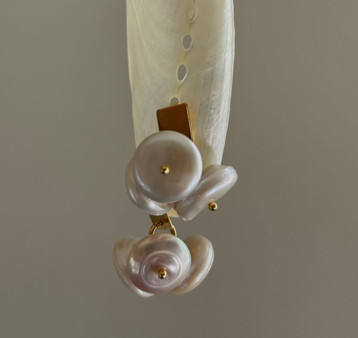 Coin Pearl Earrings hanging vertically, front view of the coin pearl cluster